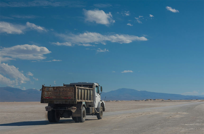 a truck driving on an isolated road